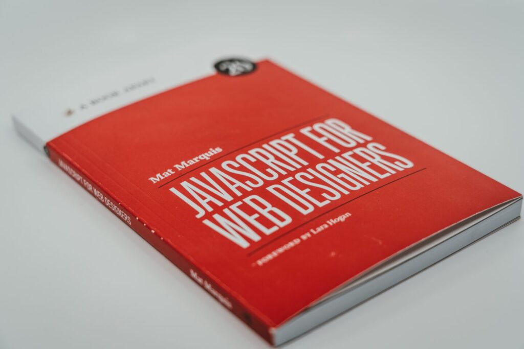 The red book with white name JavaScript for webdesigners symbolyse this article that will help understand advantages of JavaScript for web