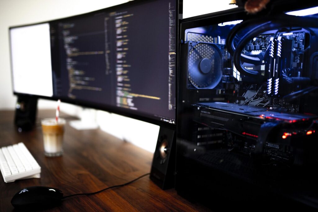 Two big mpnitors and the modern computer case on table