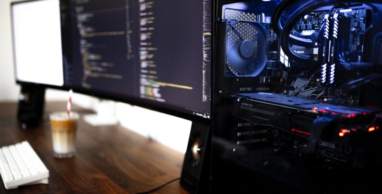 Two big mpnitors and the modern computer case on table