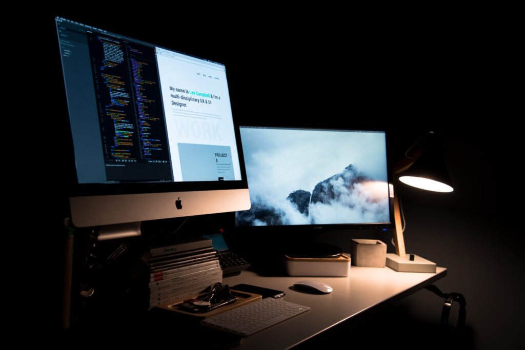 The web developer workplace in the dark room
