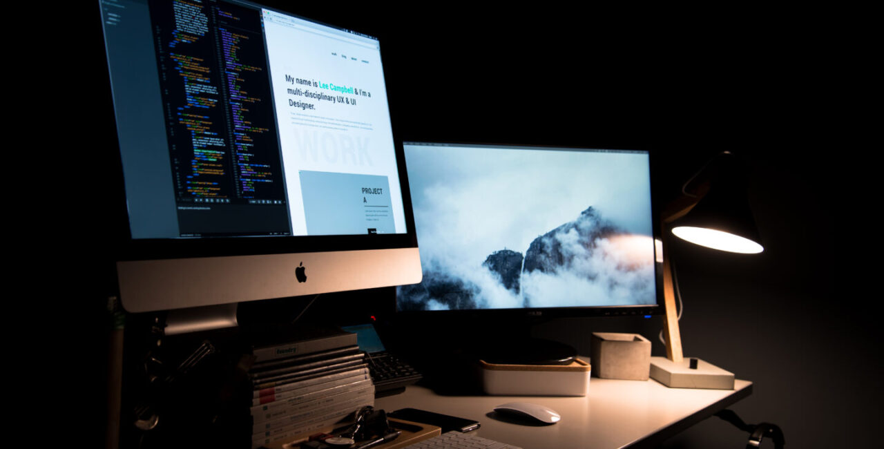 The web developer workplace in the dark room