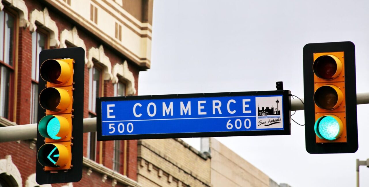 Traffic lights and sign with ecommerce caption symbolyze the ecommerce business journey