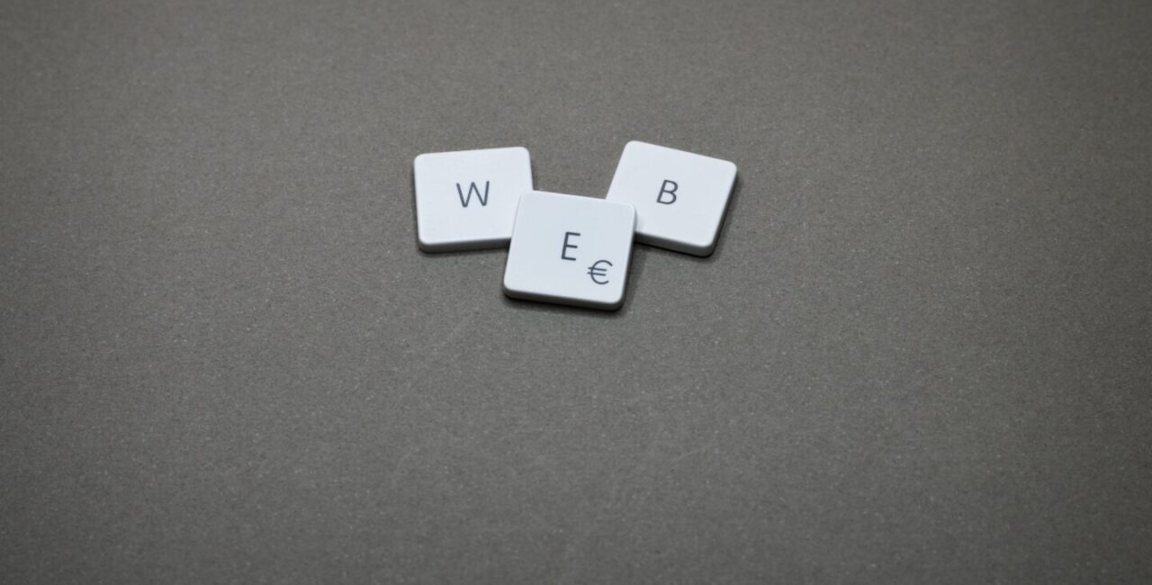 Cars with letters W, E, and B symbolize Neumorphism in UI design