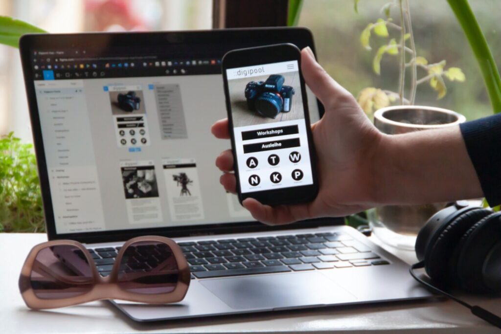 Somebody tests mobile and desctop verisons of a startup website design