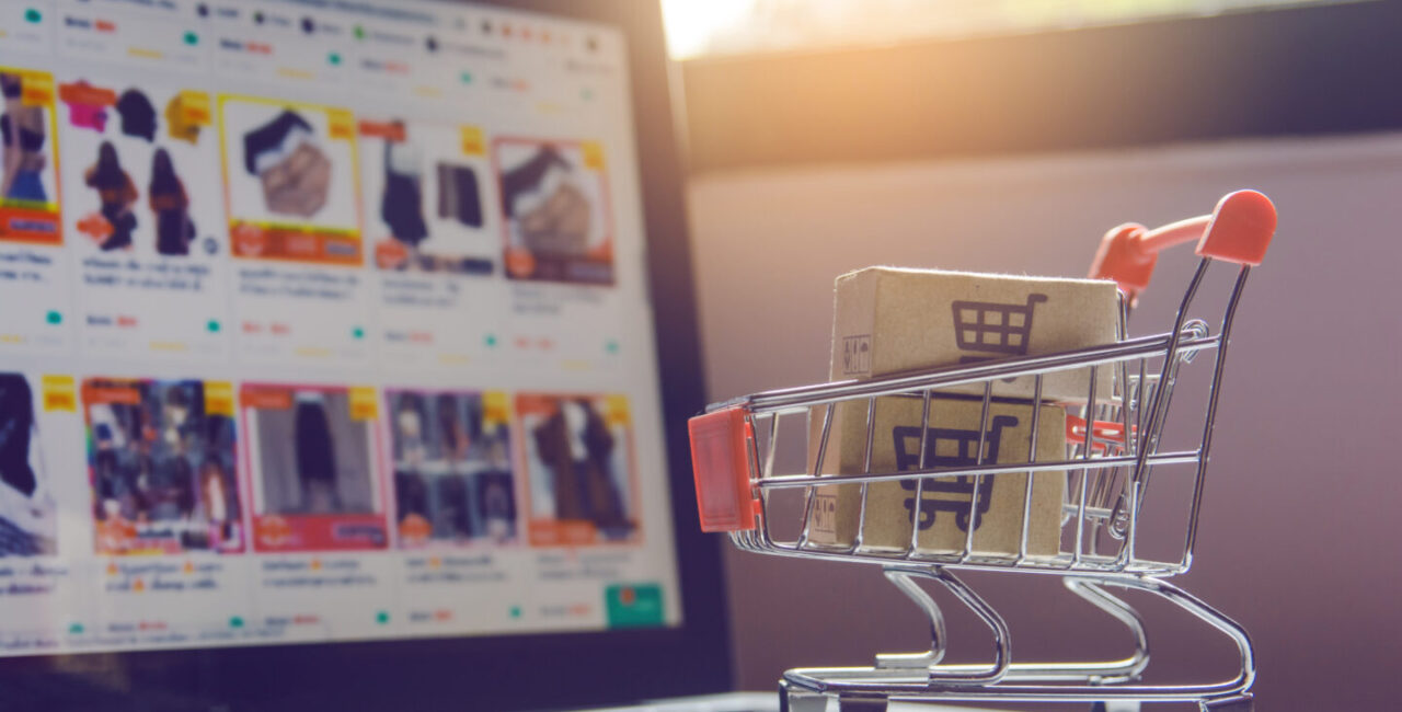 Parcel paper cartons with shopping cart logo trolley laptop keyboard