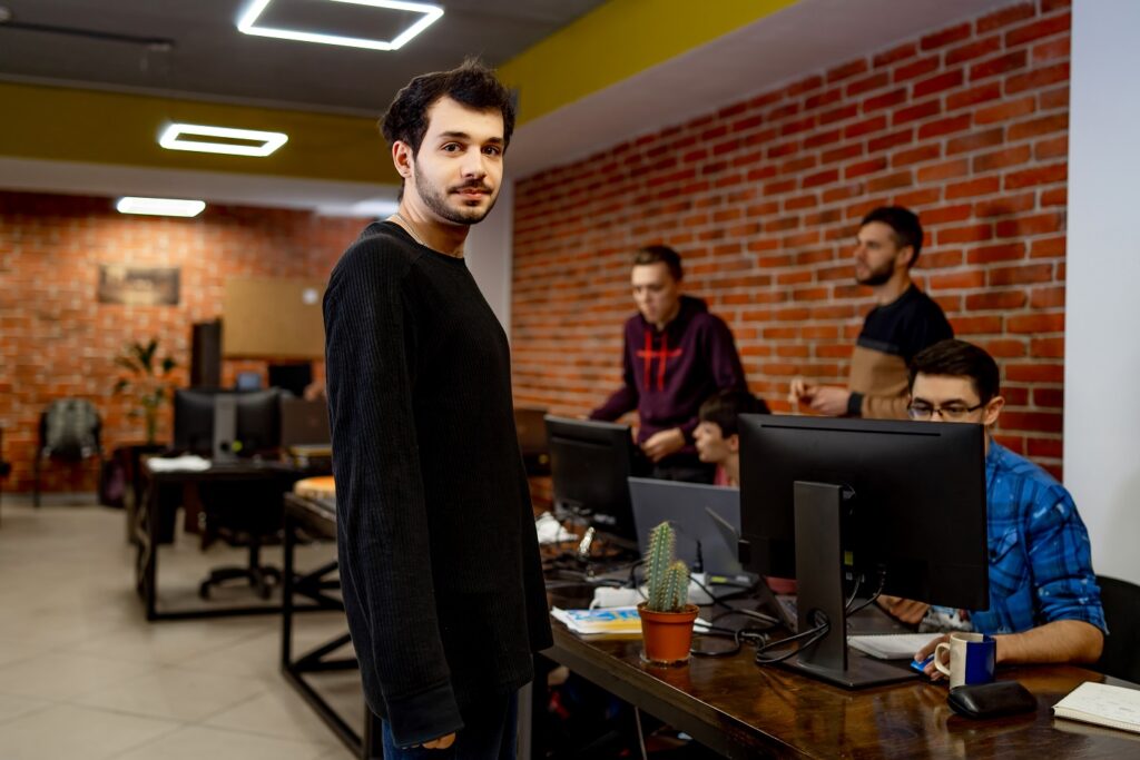 Startup business, software developer working on computer at modern office